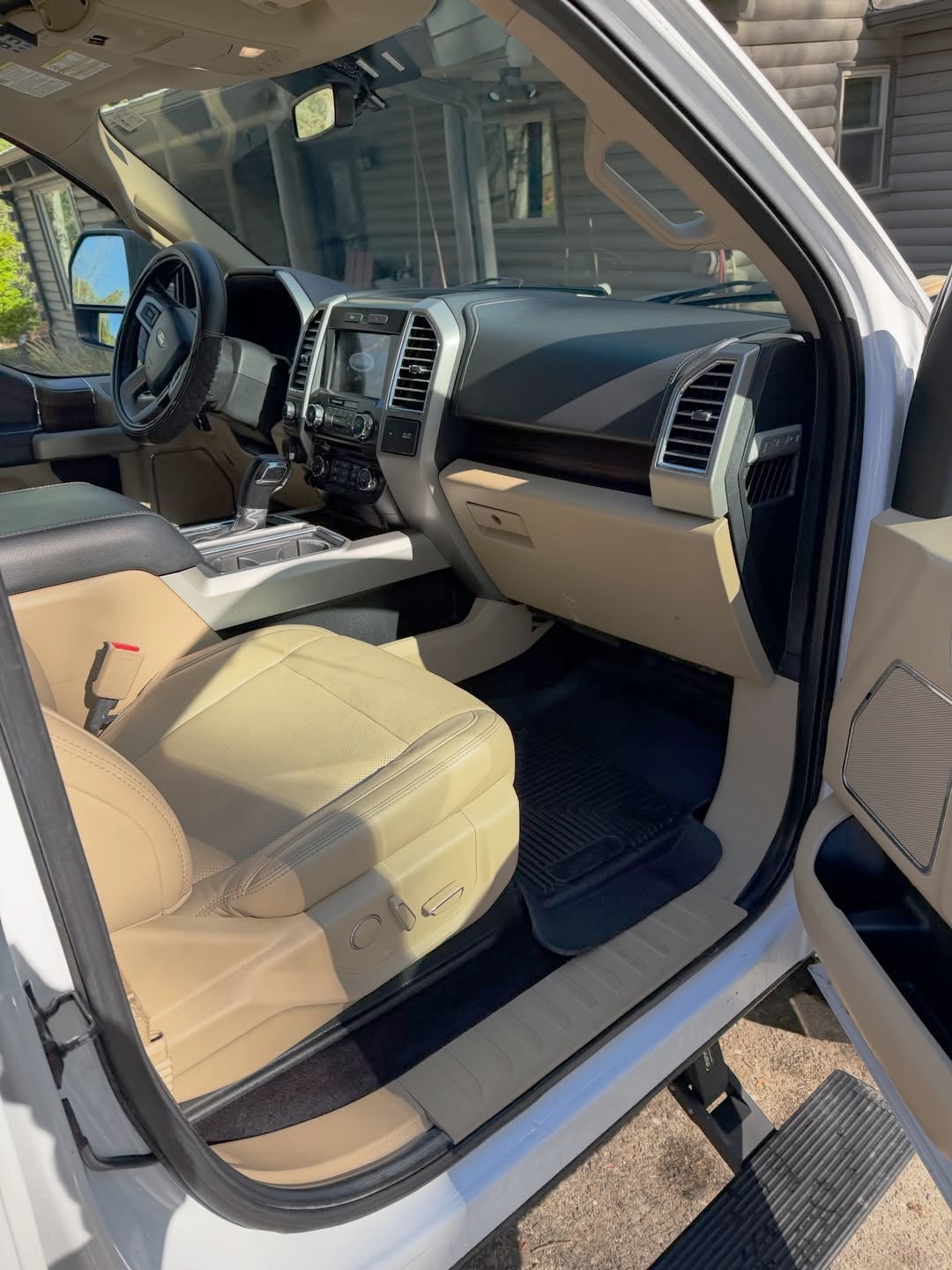 After detailing by MaddStripez Detailing — Ford F-150 — leather seats and floor mats deep-cleaned